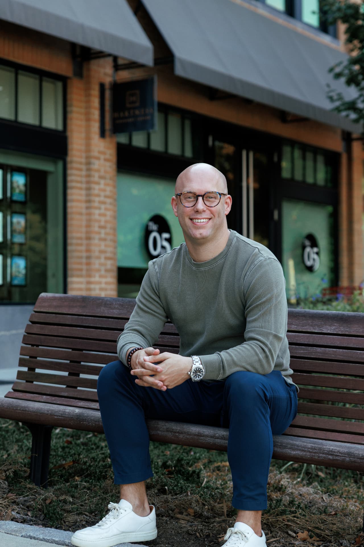 Zach Barnett, seated on a bench